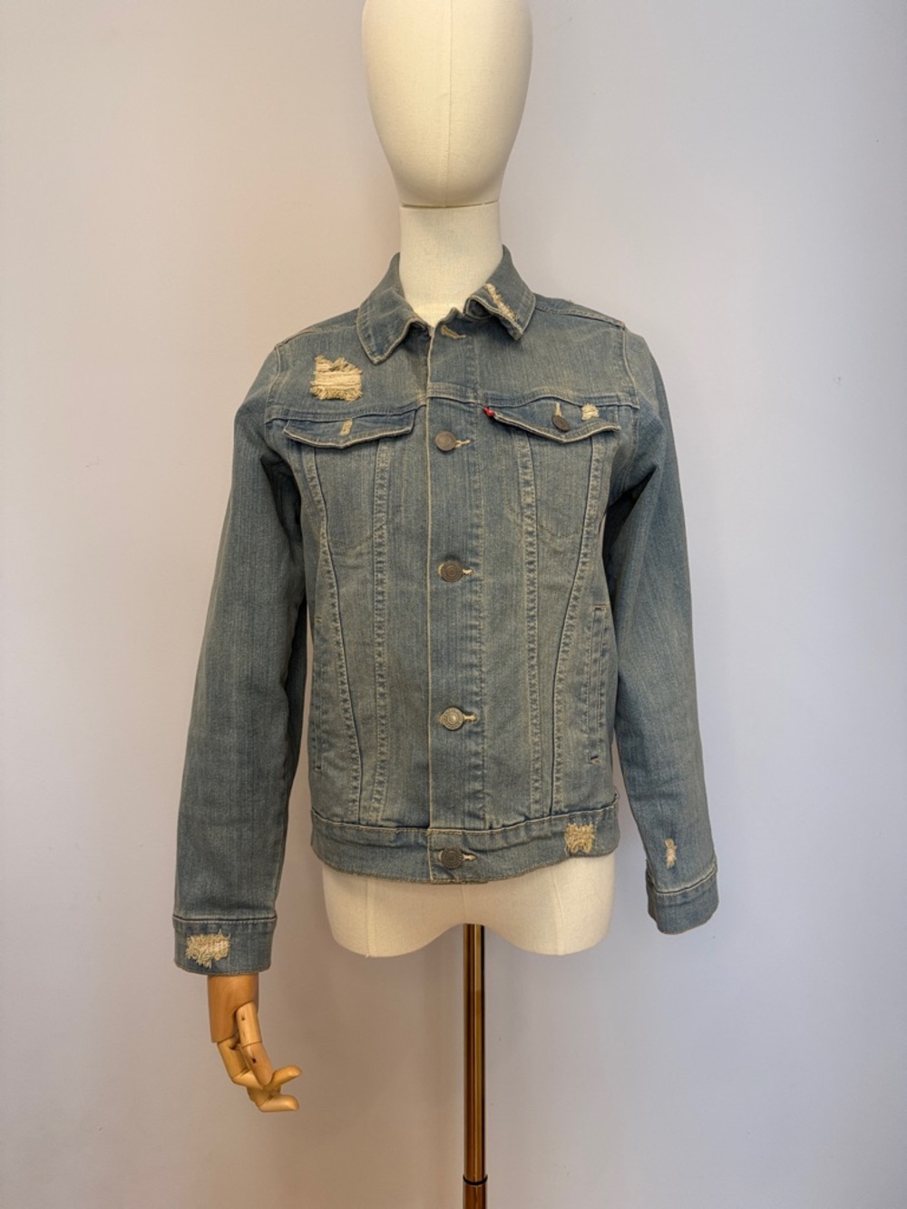 Levi’s- Classic Light Blue Distressed Denim Trucker Jacket